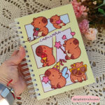 Caderno A5 - capivaras - leve defeito (amarelo)